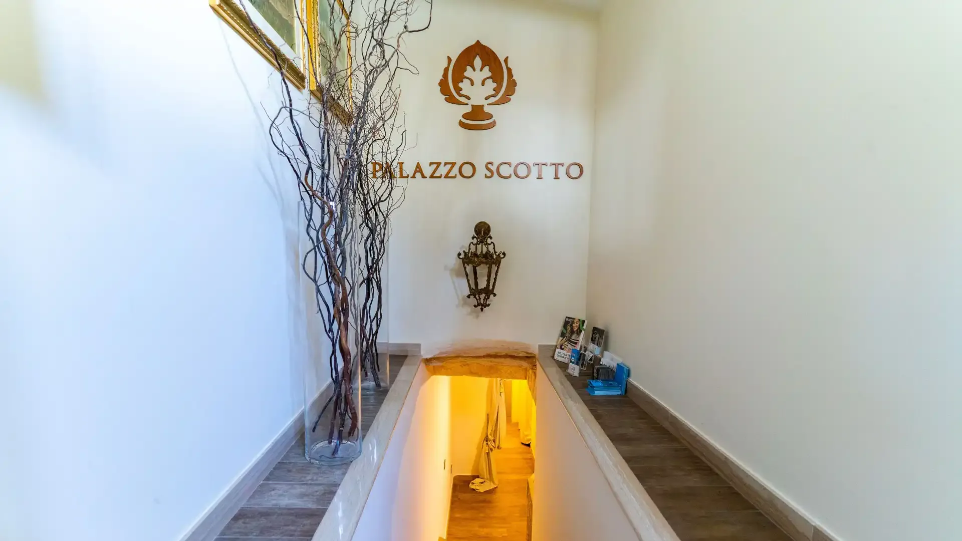 Entrance with stairs and modern decor at Palazzo Scotto.