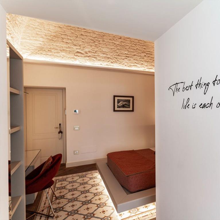 Cozy room with motivational quote on the wall.